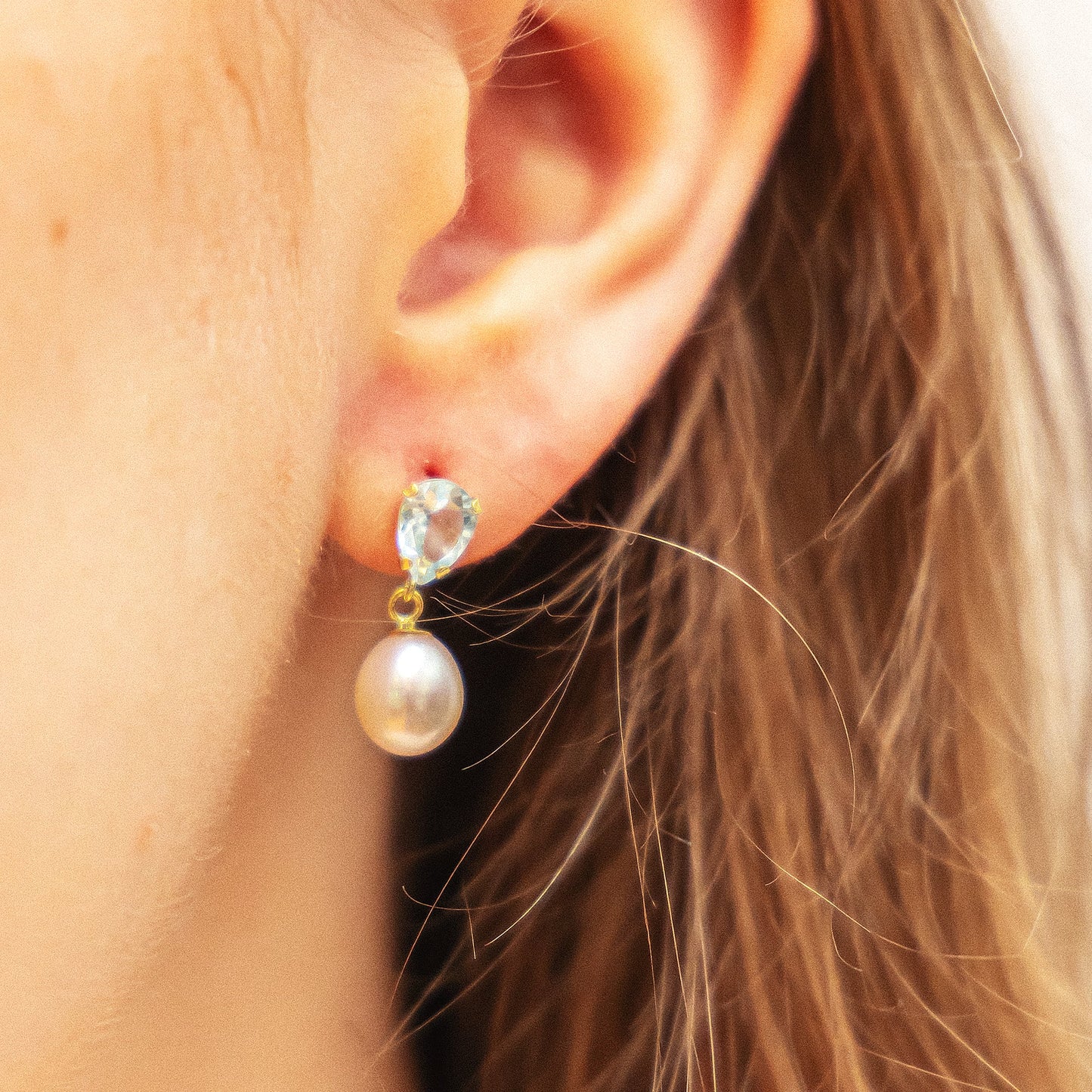 Ohrringe 333/- Gold 1,8cm Blautopas beh.